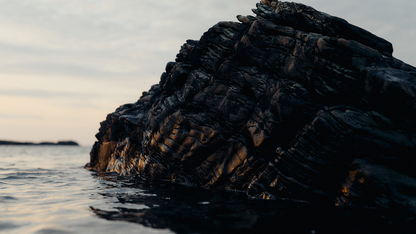 Islay rock outcrop jutting out of calm sea