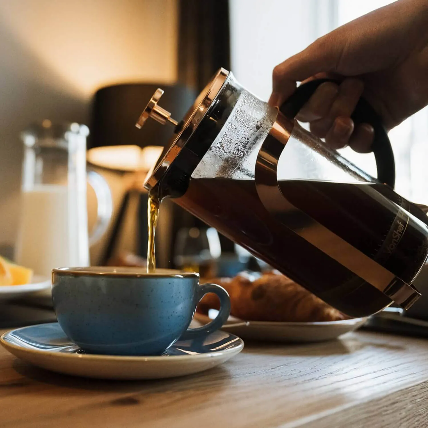 Coffee being poured from cafetière.