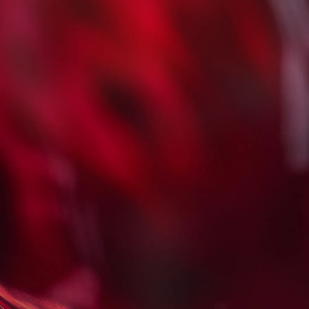 Rich red tones taking a formation suggestive of swirling liquid