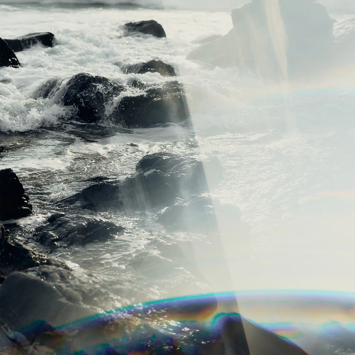 Small rocks with small white waves