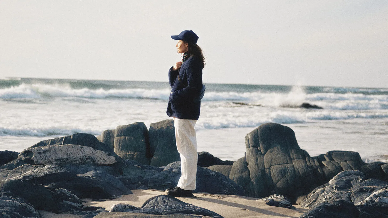 Woman staring at sea on Islay