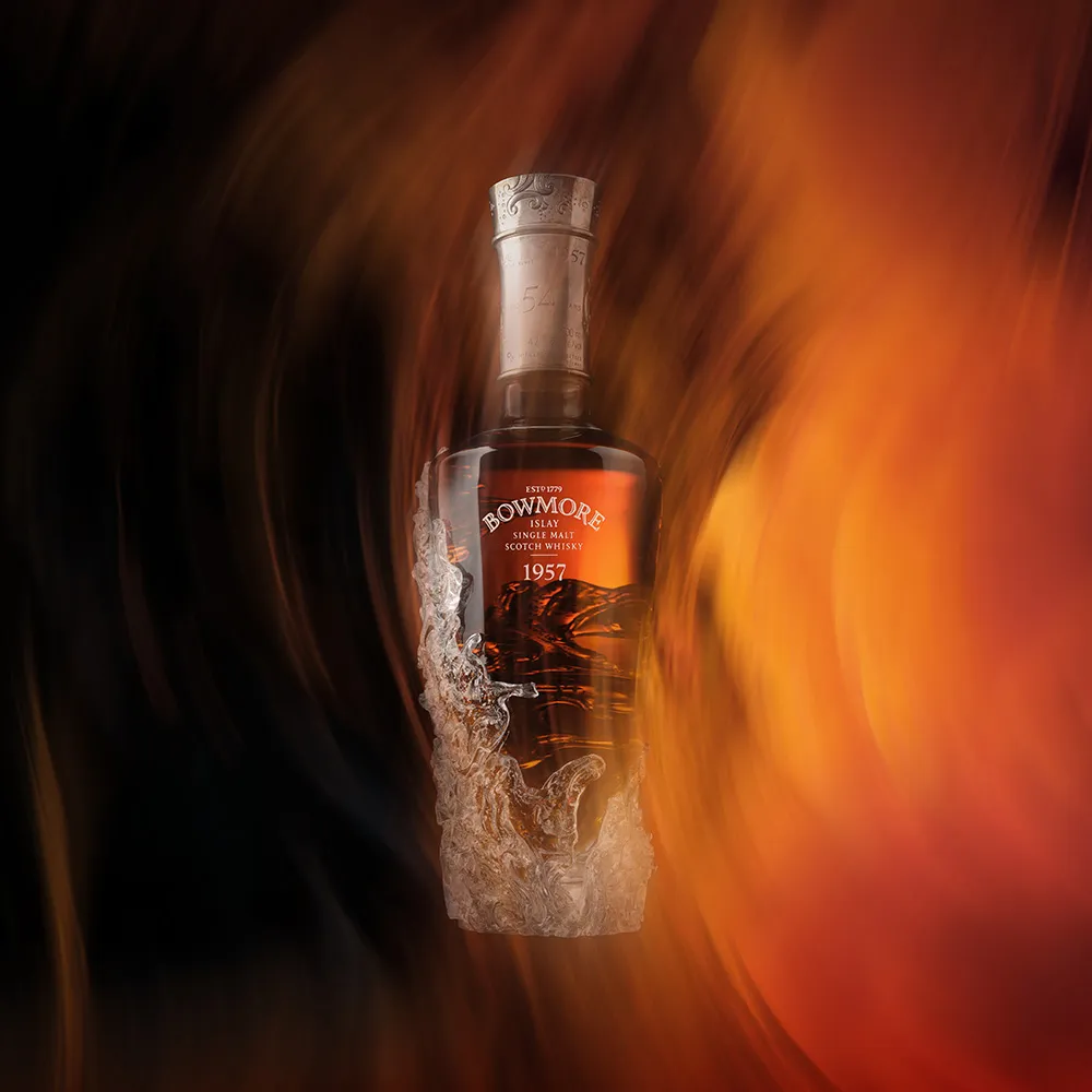 Bowmore 1957 against copper coloured brand swirl.