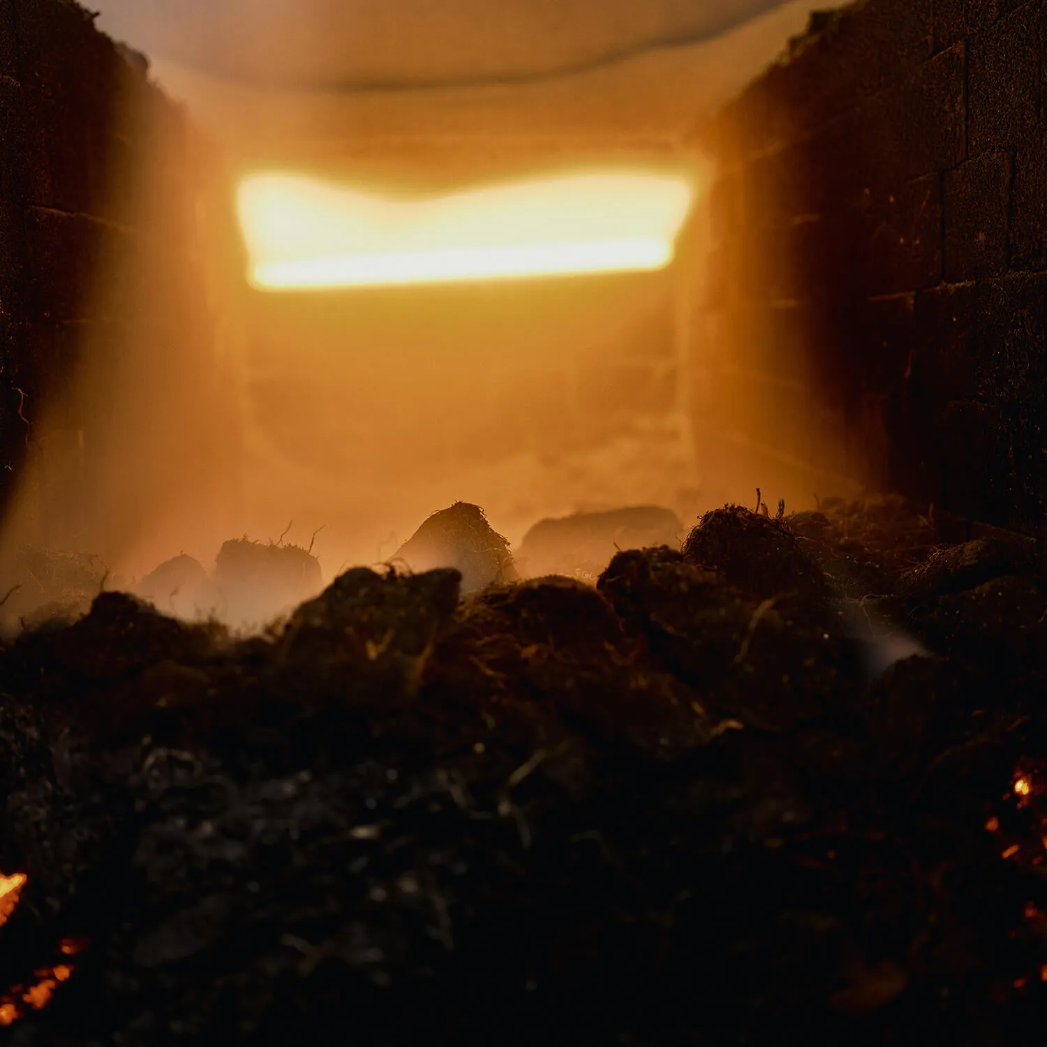 Peat glowing inside the kiln