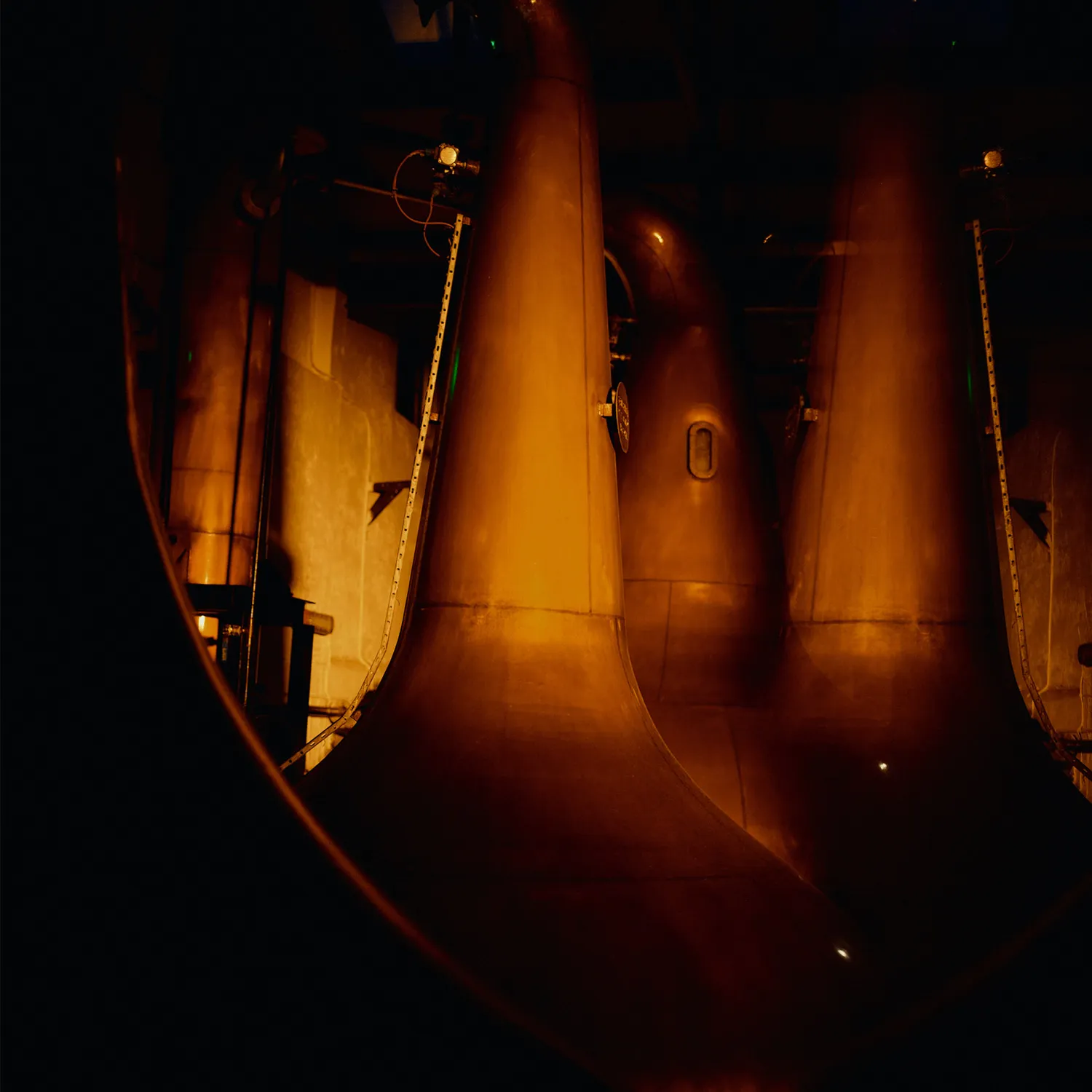 Stills at Islay distillery lit up