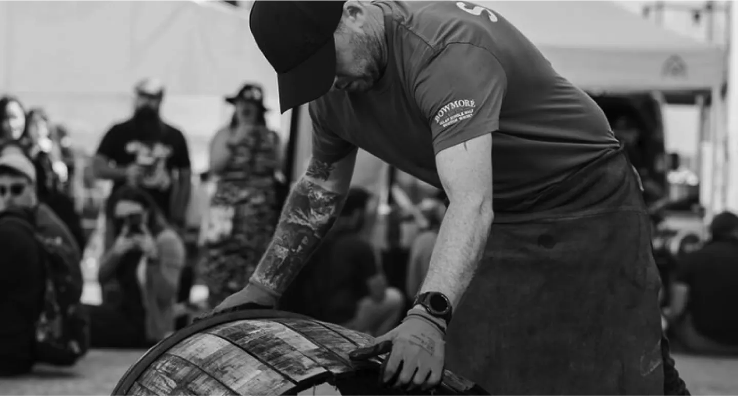 Man with barrel during Feis Ile