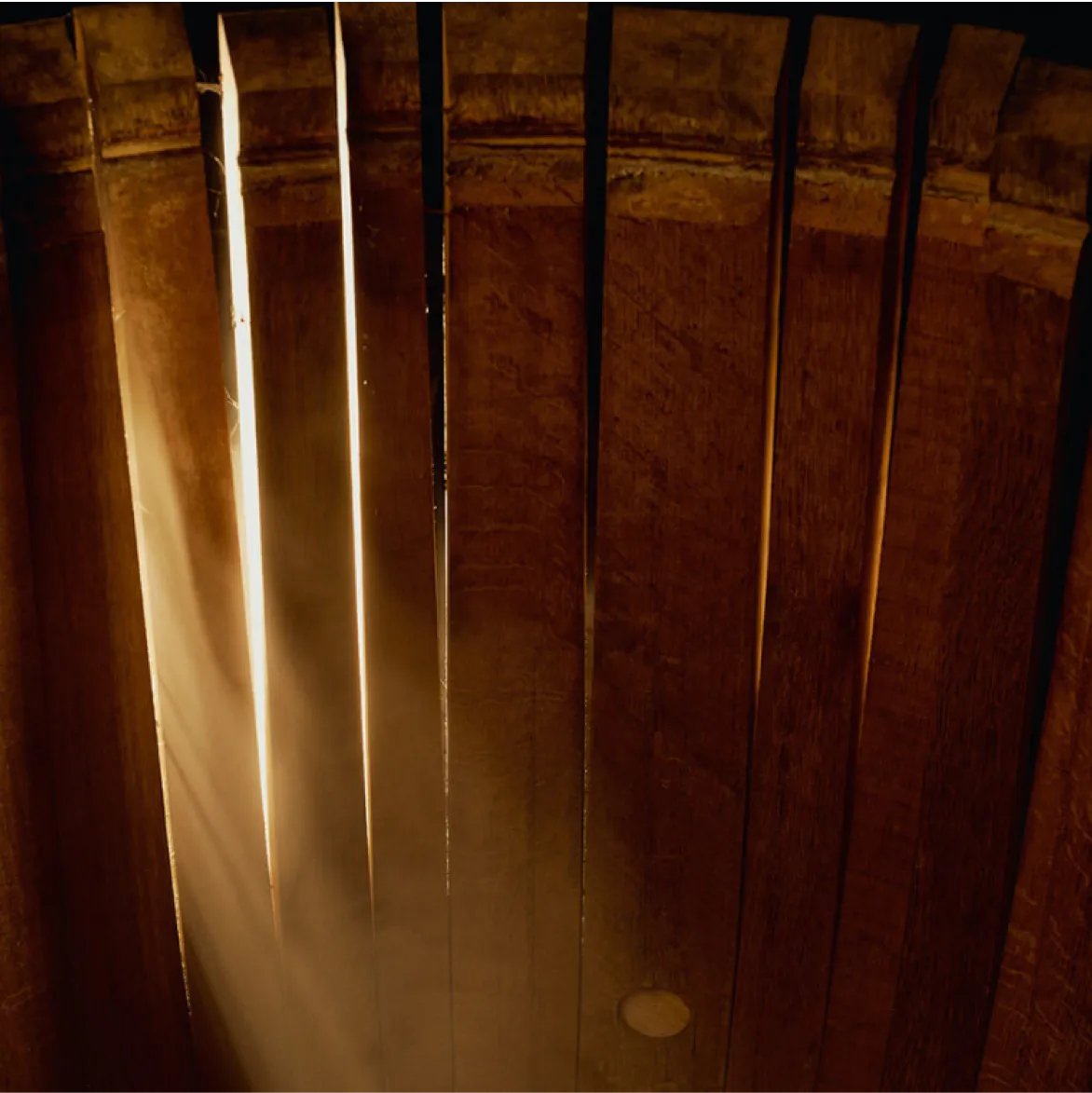 Light-shining-through-wooden-beams.