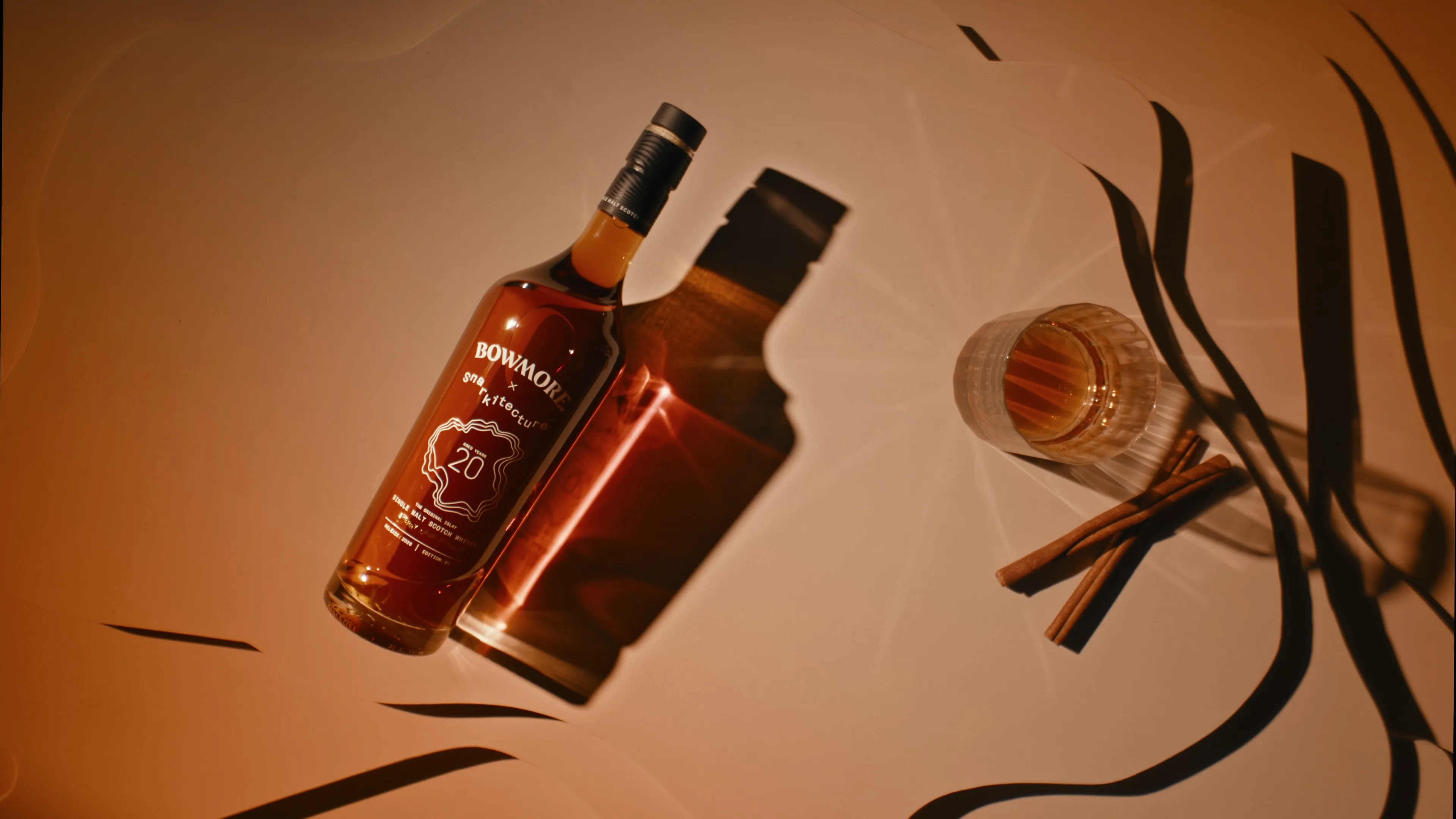 Bowmore Sherry Cask Pursuit 20 Year Old bottle with whisky glass in the Captivo setting